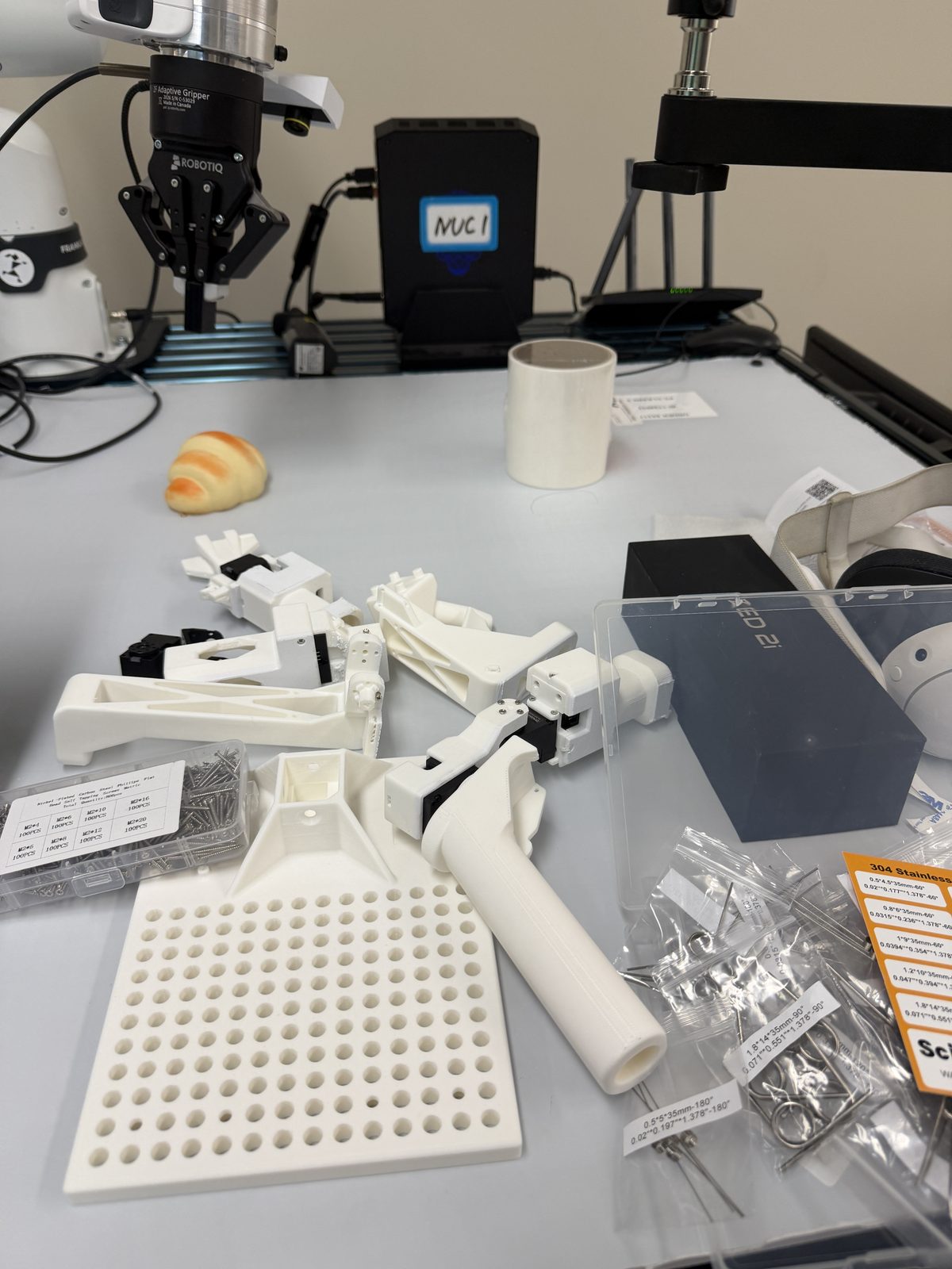 3D-printed GELLO linkages laid out during assembly
